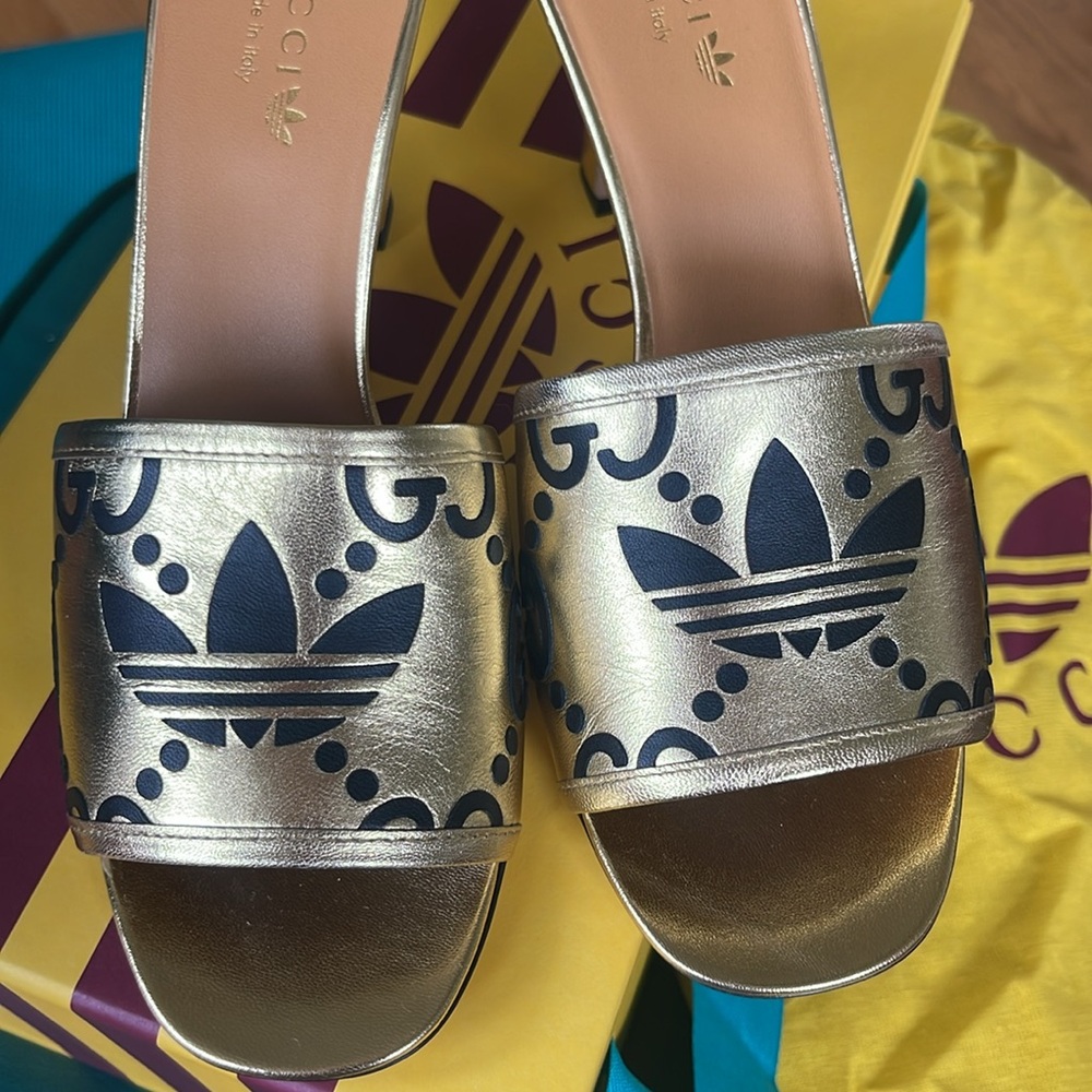 Women's Gucci X Adidas leather slide sandals. Made in Italy.